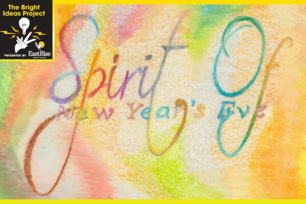 Watercolor painting of green, pink, yellow and blue. The words "Spirit of New Years Eve" is written in watercolor across the middle.